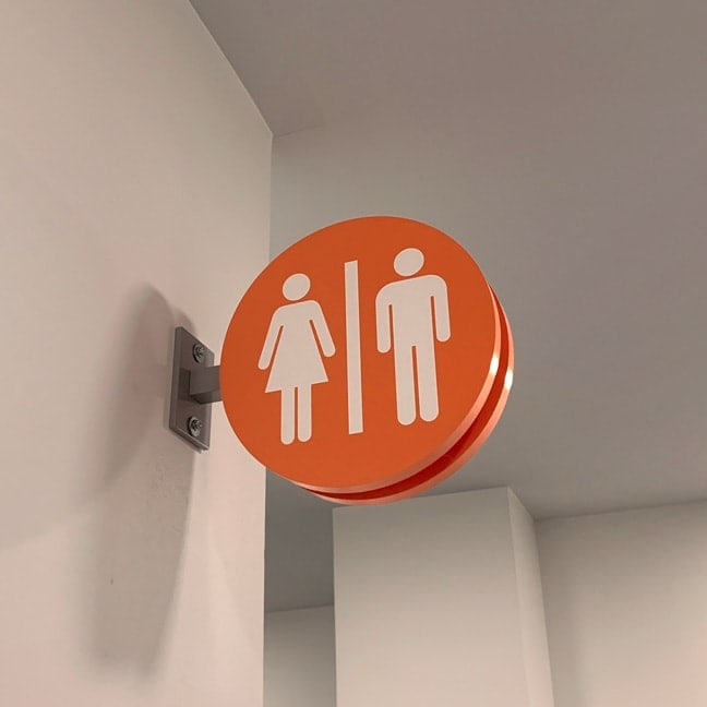 The Centrum_Interior Projecting Flag Sign Restrooms 1 PFS