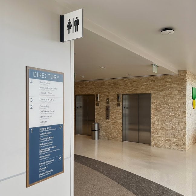 Waco Family Medicine - Interior Elevator Floor Directory EFD and Projecting Flag Sign PFS (Restrooms)