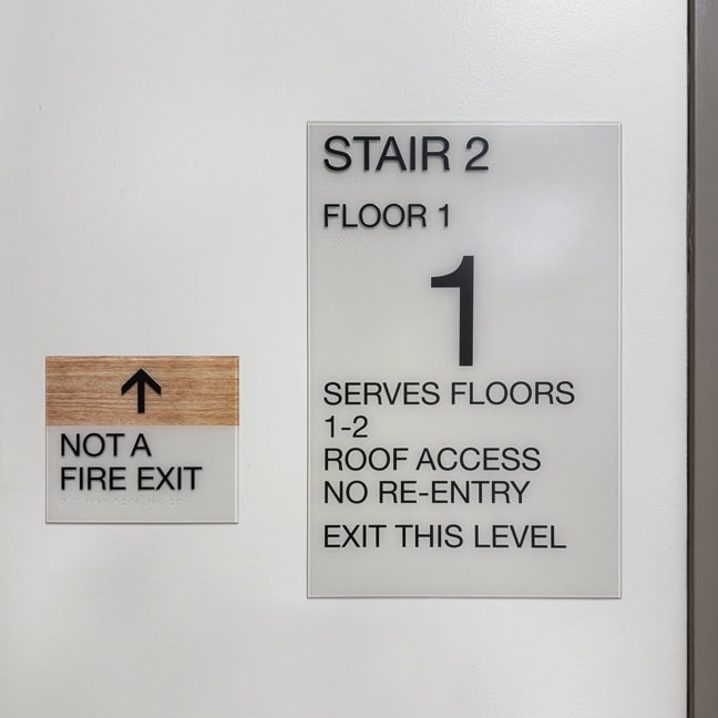Permian Basin Behavioral Health Center: Interior Interior Stairwell Plaque SWP and Fire Exit Identity FEI